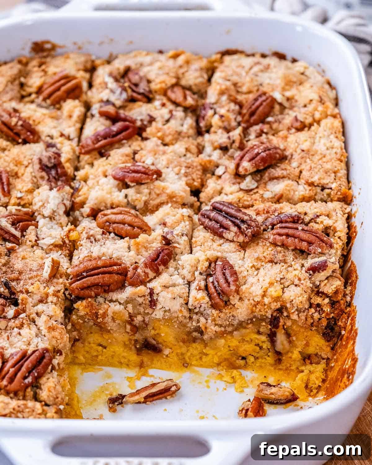 Gluten Free Pumpkin Dump Cake 2 Pumpkin dump cake in a white ceramic baking dish