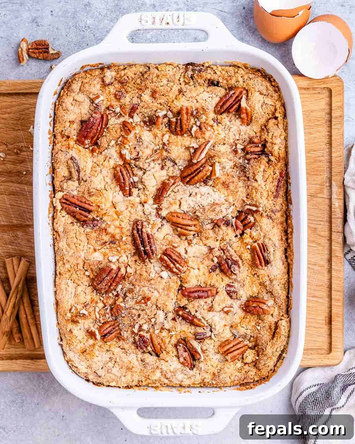 Gluten Free Pumpkin Dump Cake 6 pumpkin dump cake in a white casserole dish.