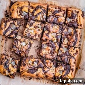 brownie squares on parchment paper made with a pumpkin base.