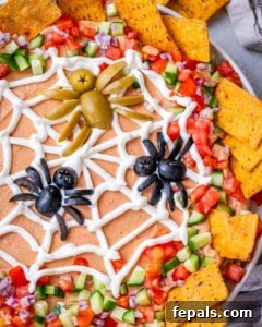 Top view close-up of the olive spiders sitting on the sour cream spider web.