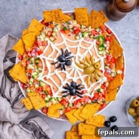 a round bowl with taco dip, thats a spider web theme.