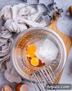 Spooktacularly Easy Halloween Cookies Kids Will Love 10 sugar, eggs, and oil in a bowl to be mixed for cookies.