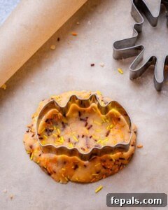 Spooktacularly Easy Halloween Cookies Kids Will Love 13 Use a cookie cutter over the cookie dough to cut into a bat shape.