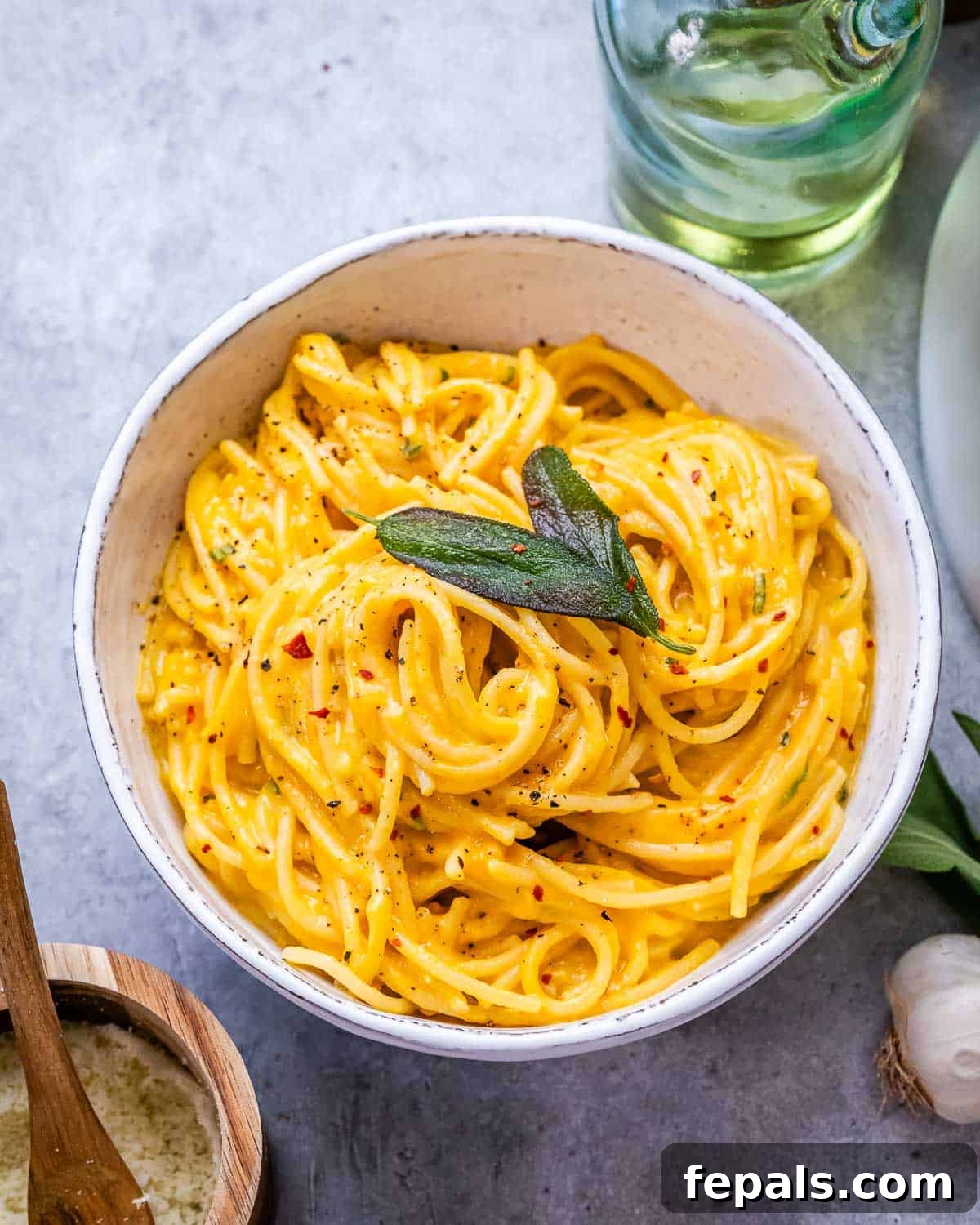Simple Comfort Pumpkin Alfredo 2 A beautifully plated bowl of creamy pumpkin alfredo pasta, garnished with fresh herbs, ready to be enjoyed.