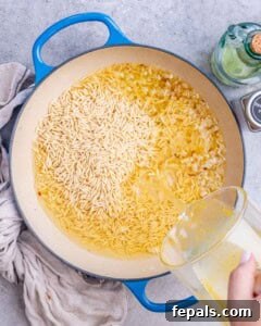 Orzo cooking with cheese