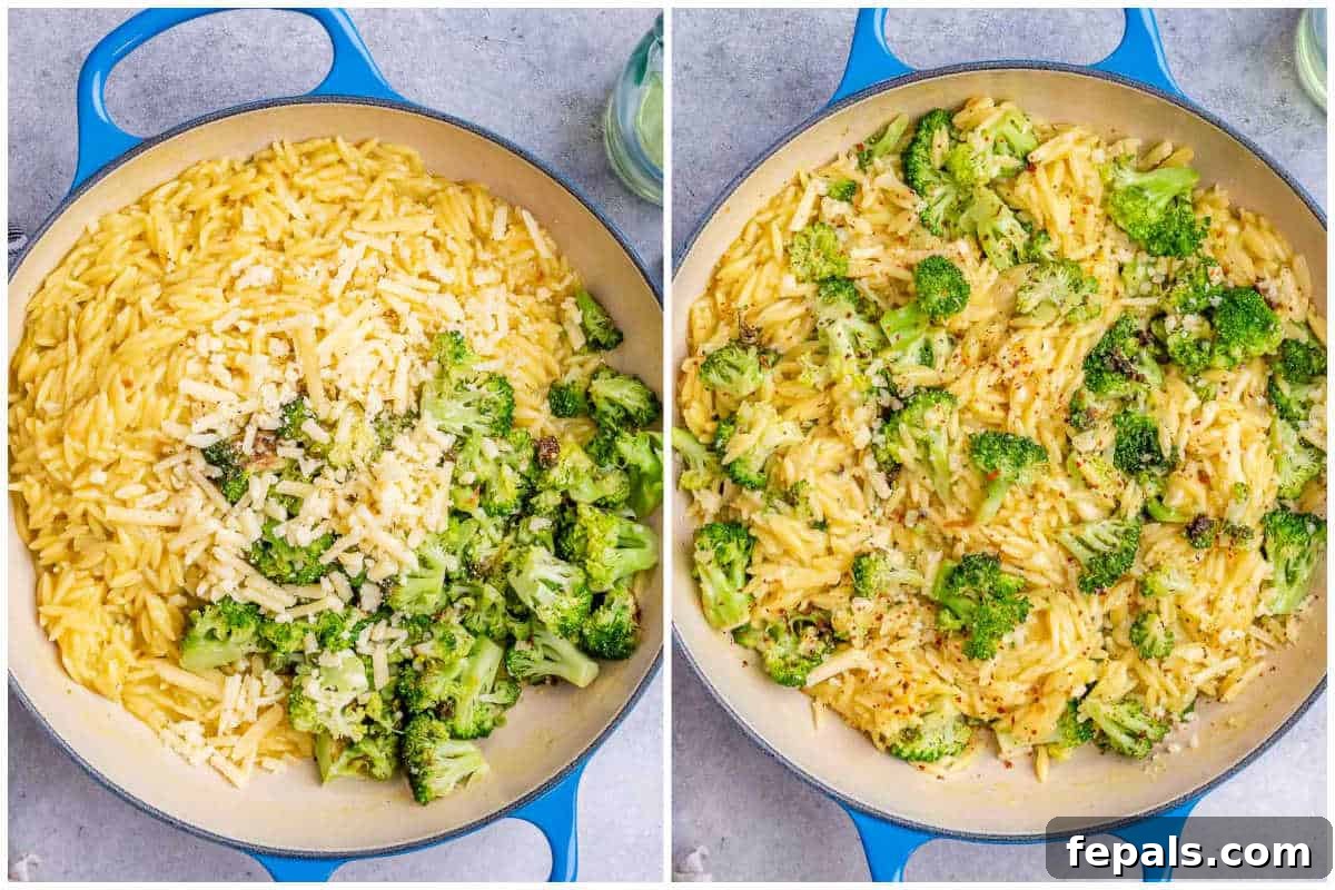 Cooked broccoli being stirred into the cheesy orzo pasta in a skillet.