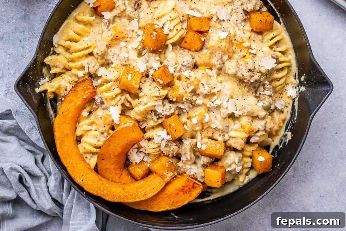 Savory Butternut Squash & Beef Ragu Pasta 2 A vibrant skillet filled with creamy butternut squash pasta, tender ground beef, and fresh herbs, ready to be served.