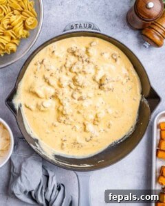Savory Butternut Squash & Beef Ragu Pasta 13 Overhead shot showing the creamy sauce coating the meat mixture.