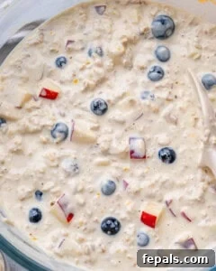 Overnight oats ingredients, fully mixed together in a bowl, showcasing the final creamy and textured breakfast.