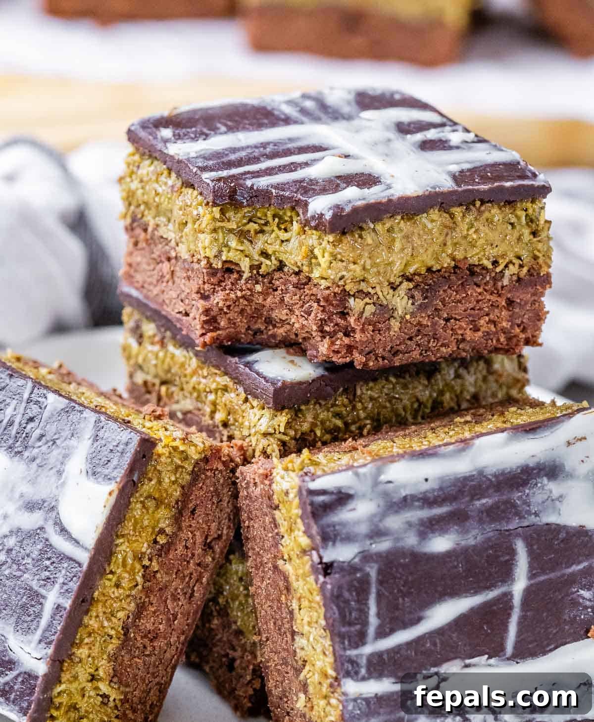 A stack of Dubai brownies, one with a bite taken out.