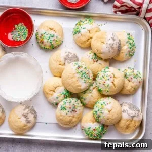 Sweet Italian Christmas Delights 14 baked Christmas cookies on a sheet pan.