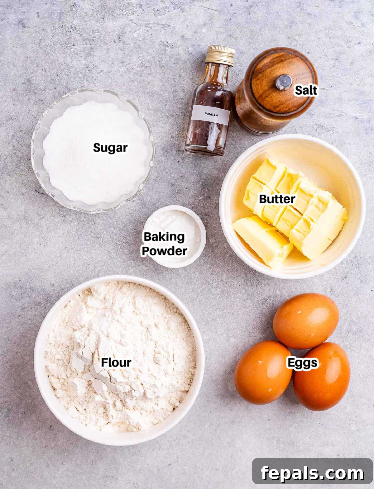 Sweet Italian Christmas Delights 3 A collection of ingredients laid out on a wooden surface, including butter, sugar, eggs, flour, and sprinkles, ready to make Christmas cookies.