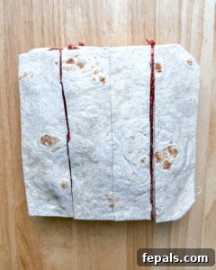tortilla layered with beef sliced longways.