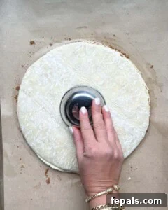 A small bowl pressed into the center of the puff pastry as a guide for cutting radial slices.