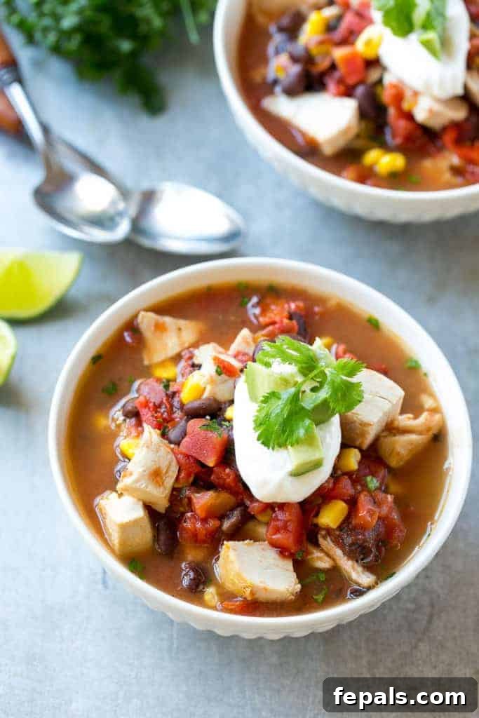 top view of two white small bowls that have Mexican chicken soup
