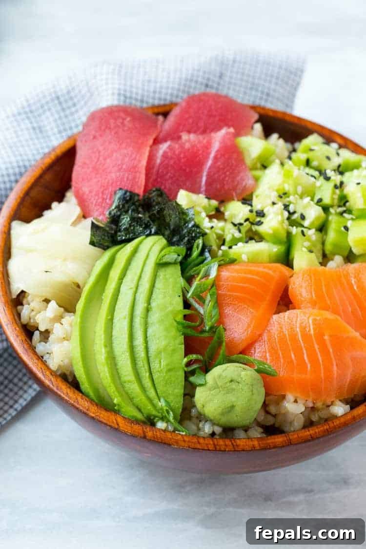 Easy Salmon Sushi Bowl A beautifully arranged sushi rice bowl overflowing with fresh vegetables and seafood, ready to be enjoyed.