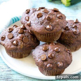close up of chocolate muffins on a plate
