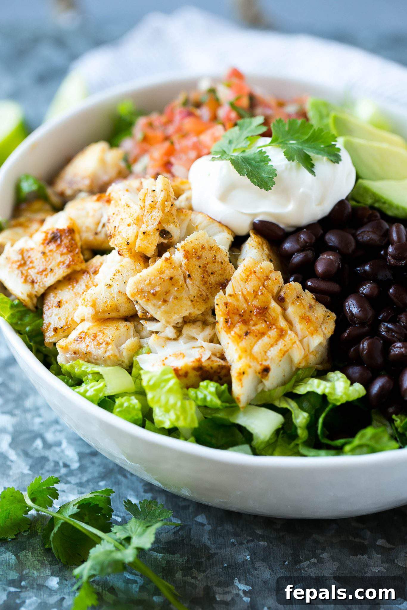 Easy Healthy Fish Taco Salad Bowl Recipe Easy fish taco bowl with crispy, perfectly seasoned fish, ready to be enjoyed as a healthy and flavorful meal.