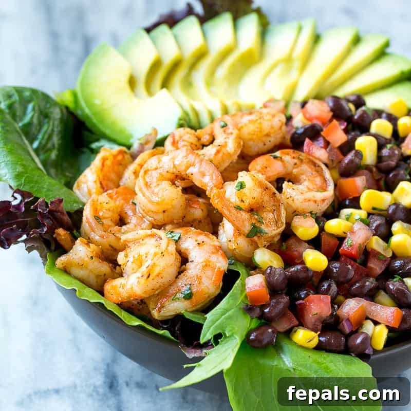 Colorful and inviting Mexican shrimp salad with a vibrant mix of salsa, greens, and avocado.