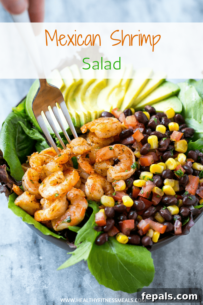 A visually appealing top-down shot of an easy-to-make shrimp salad recipe, showcasing the fresh ingredients.