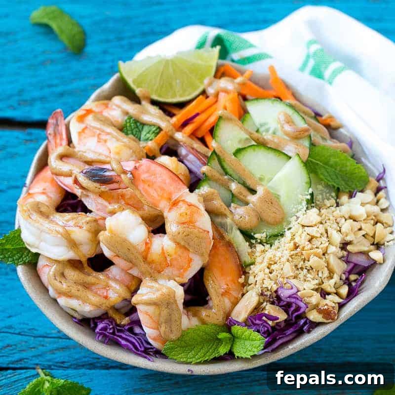 Asian Peanut Shrimp Salad 3 Top-down view of a colorful Shrimp Salad with Peanut Dressing in a white bowl, ready to be served.