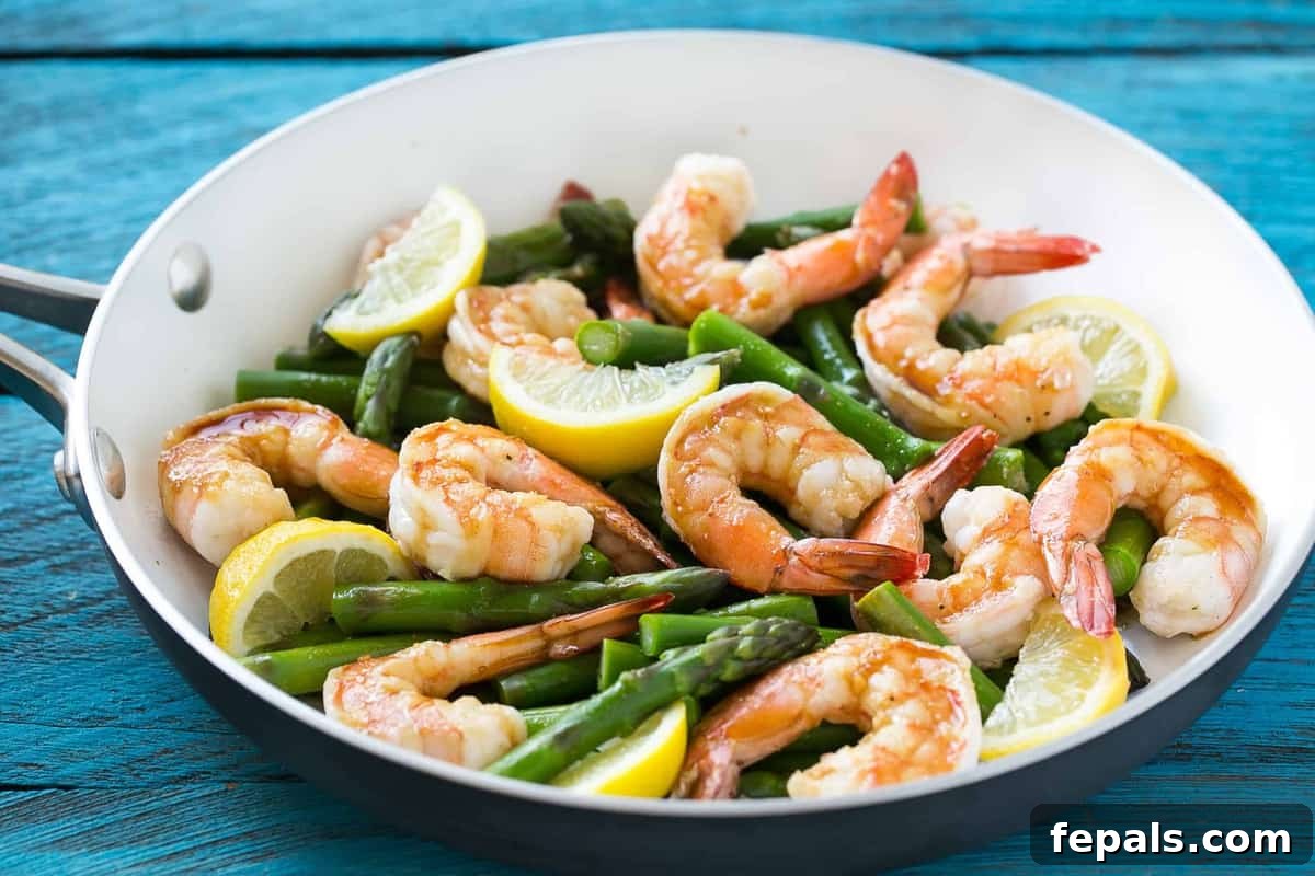 Lemon Asparagus Shrimp in a skillet, ready to be served