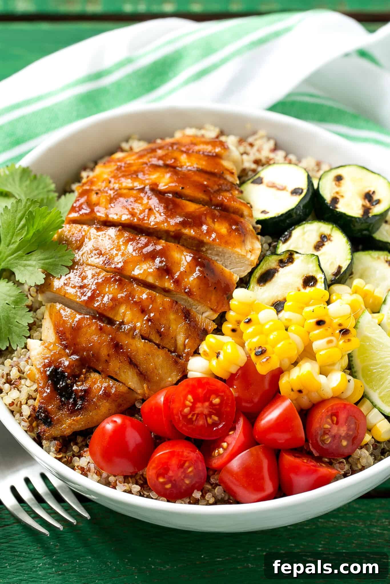 BBQ Chicken Quinoa Bowl bbq chicken in bowl with fresh vegetables and quinoa