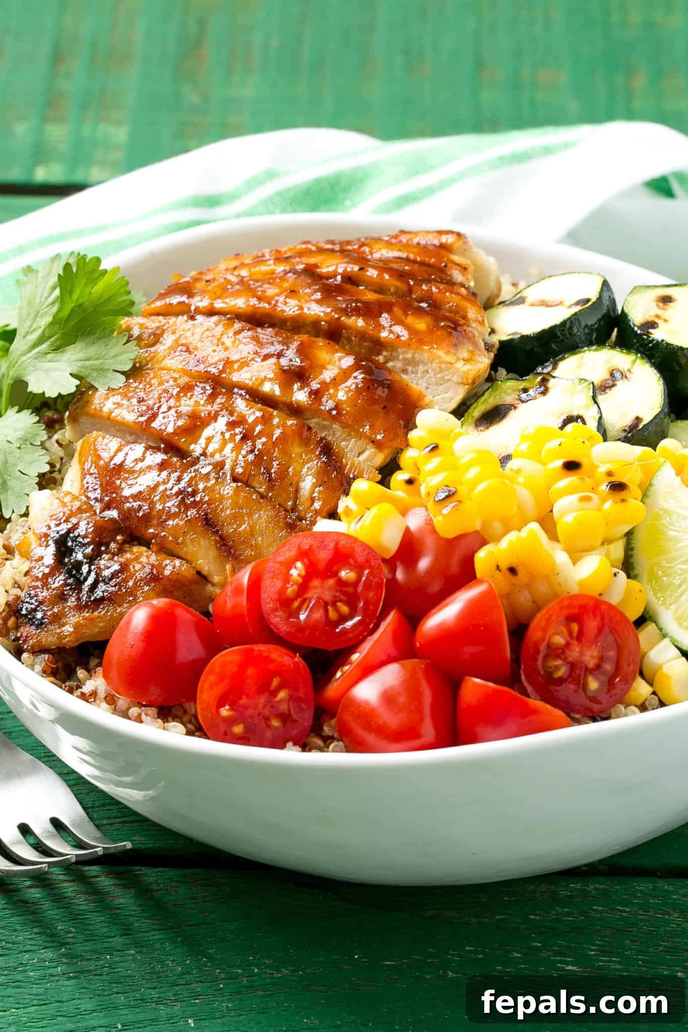 Simple Grilled BBQ Chicken Quinoa Bowl bbq chicken in bowl with fresh vegetables and quinoa
