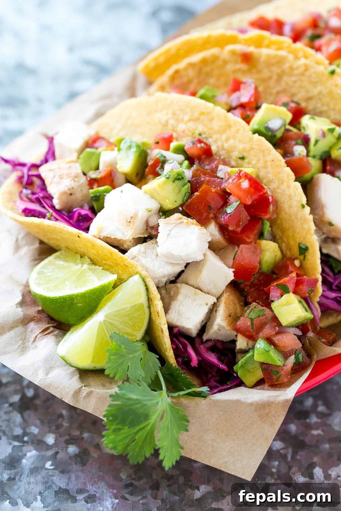 chicken tacos with lime wedges and cilantro