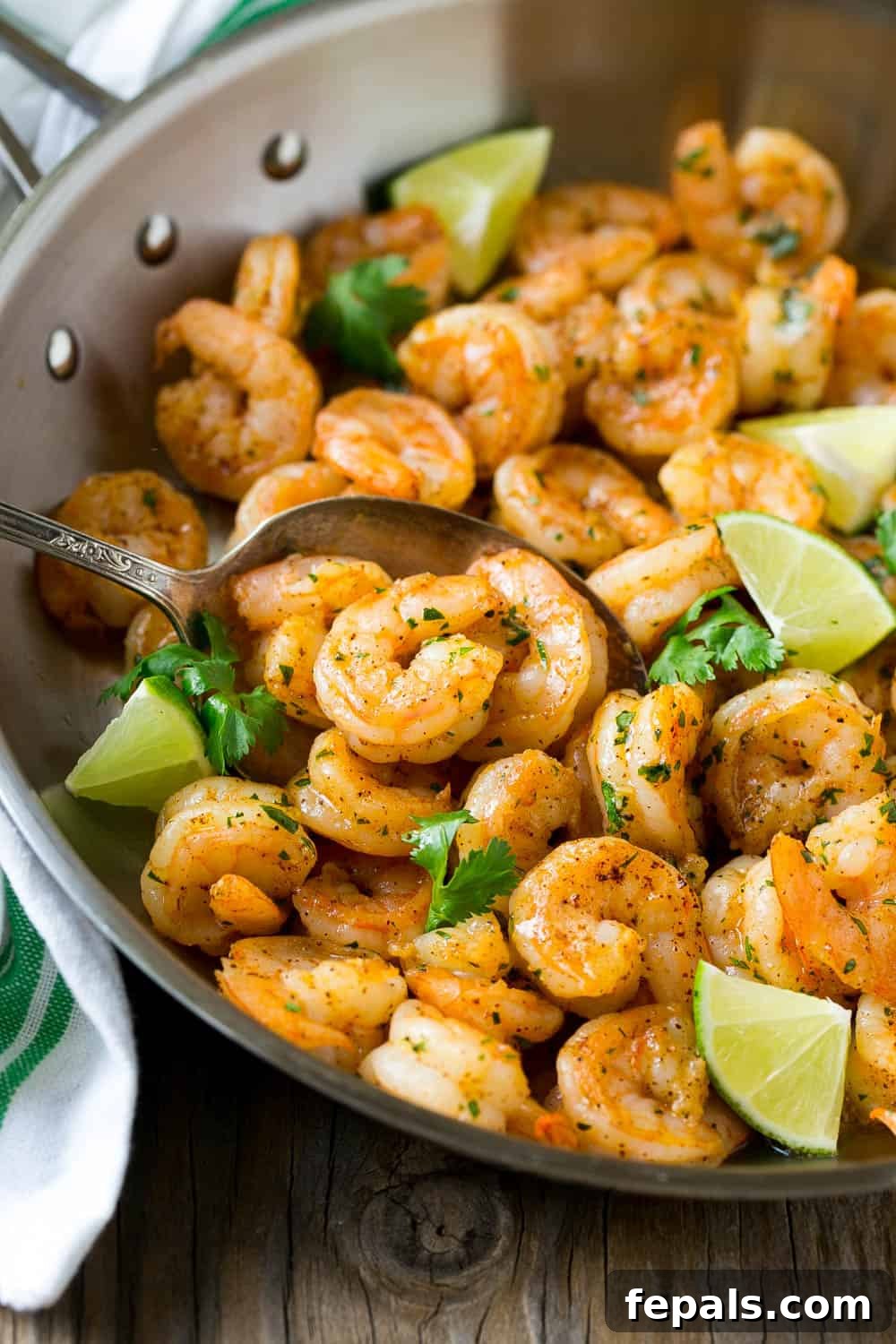 Delicious cilantro lime shrimp served in a bowl, garnished with lime and cilantro