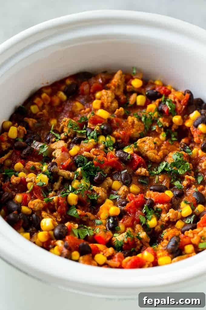 Effortless Slow Cooker Southwest Turkey Chili 3 turkey chili simmering in a slow cooker, showing its rich texture and ingredients