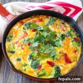 frittata recipe in cast iron skillet with towel