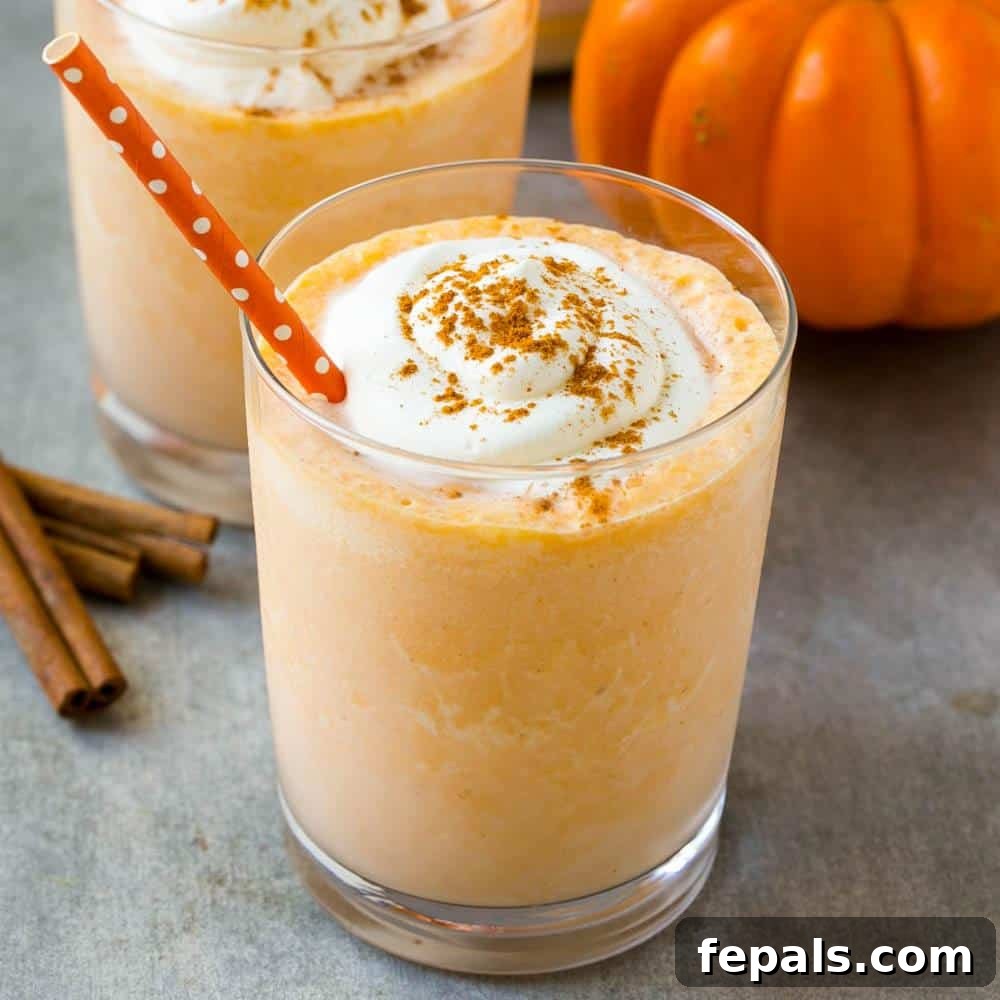 Pumpkin Spice Protein Power Smoothie 2 A rich, creamy pumpkin pie protein smoothie in a clear glass, ready to be enjoyed.