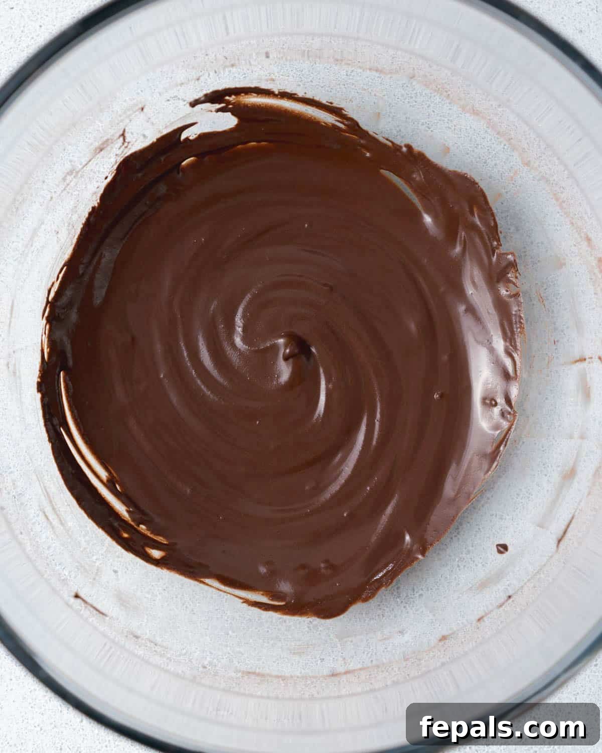 Decadent Chocolate Protein Chia Bliss 6 thick chocolate sauce in a bowl.