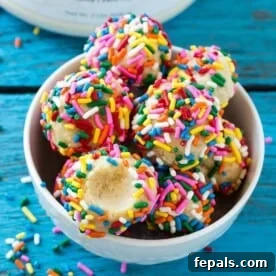 no bake birthday cake protein bites in white bowl