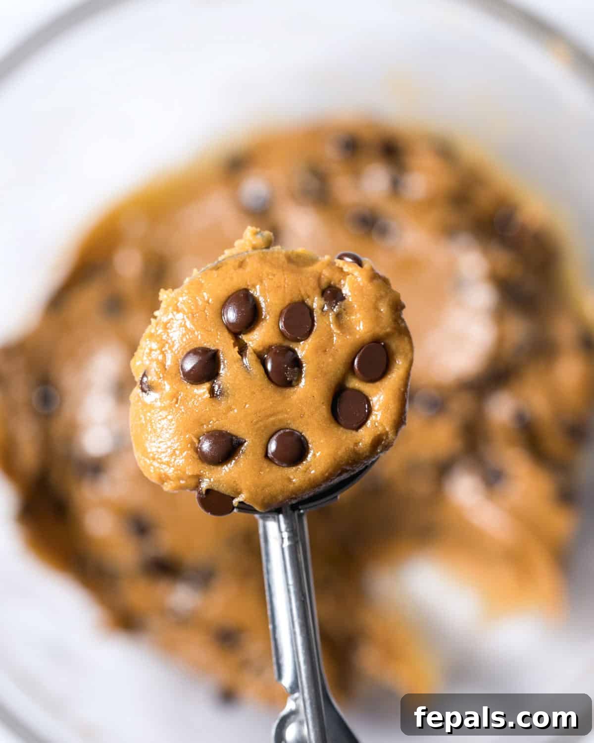 Power-Packed Protein Chocolate Cookies 9 A scoop of raw chocolate chip protein cookie dough.