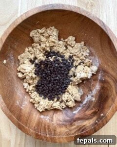 Mini chocolate chips are added to the peanut butter oats dough.