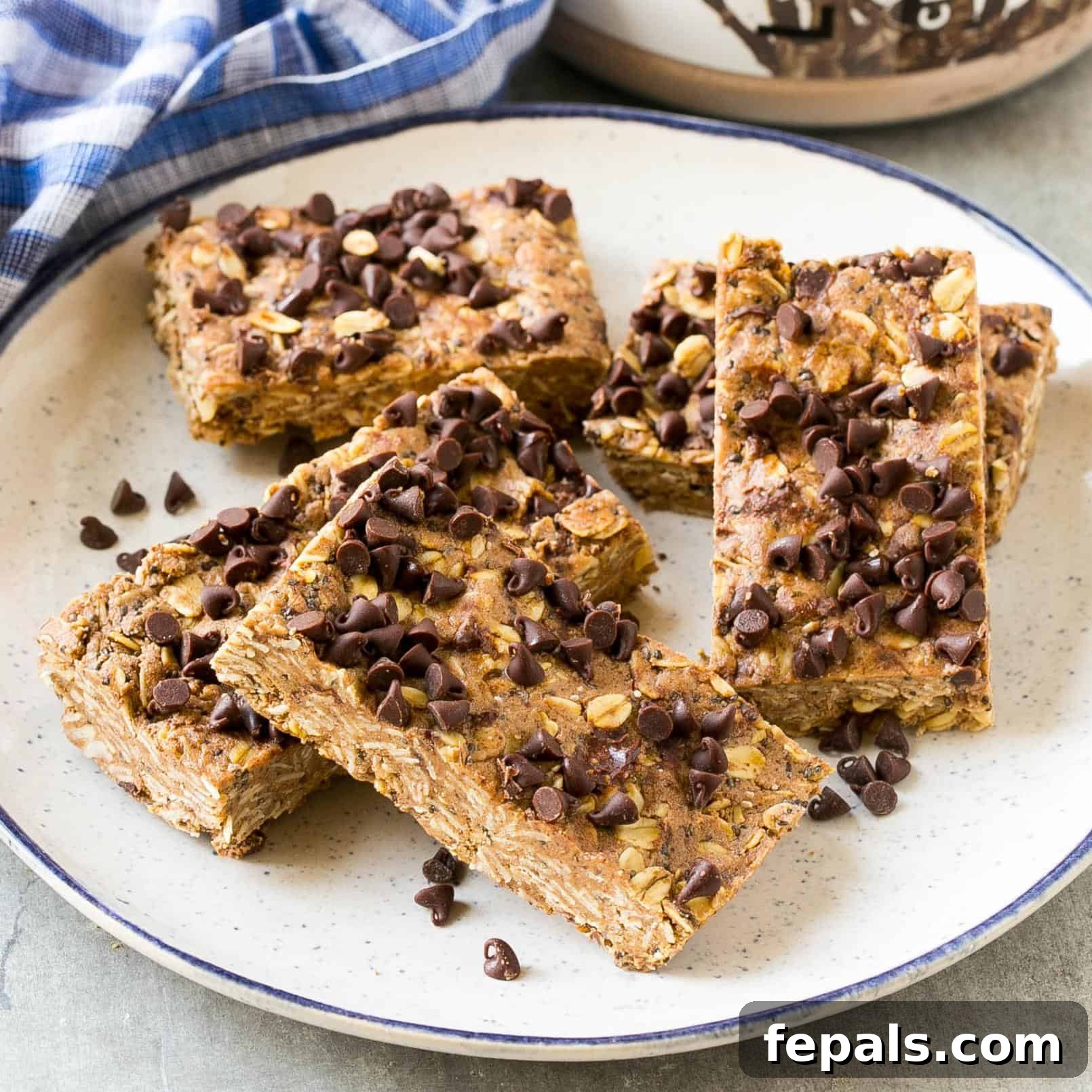 A selection of healthy protein bars on a plate, garnished with chocolate chips, ready for a nutritious snack.