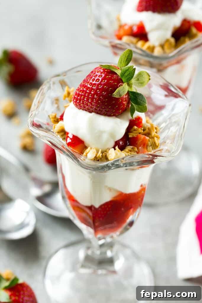 Strawberry Parfait Perfection 4 side shot of strawberry parfait topped with fresh strawberry