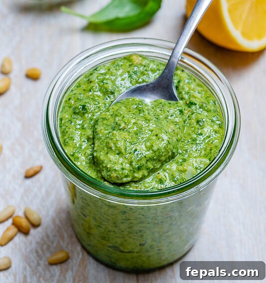 Garden Fresh Pesto Bliss 6 jar of pesto with a spoon in a jar with homemade pesto