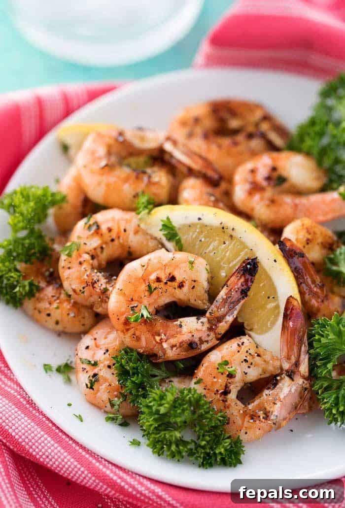 Easy Grilled Honey Lemon Shrimp Recipe Grilled Honey Lemon Shrimp skewers with fresh lemon slices and parsley