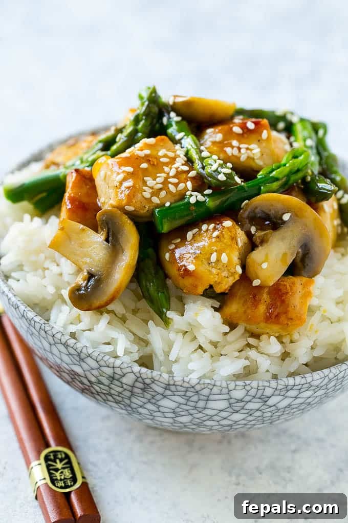 One Pan Chicken Asparagus Dinner 4 Best Chicken Stir Fry Recipe featuring tender chicken, fresh asparagus, and savory mushrooms.