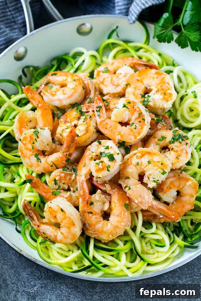 Shrimp Scampi Zoodles on a white plate.