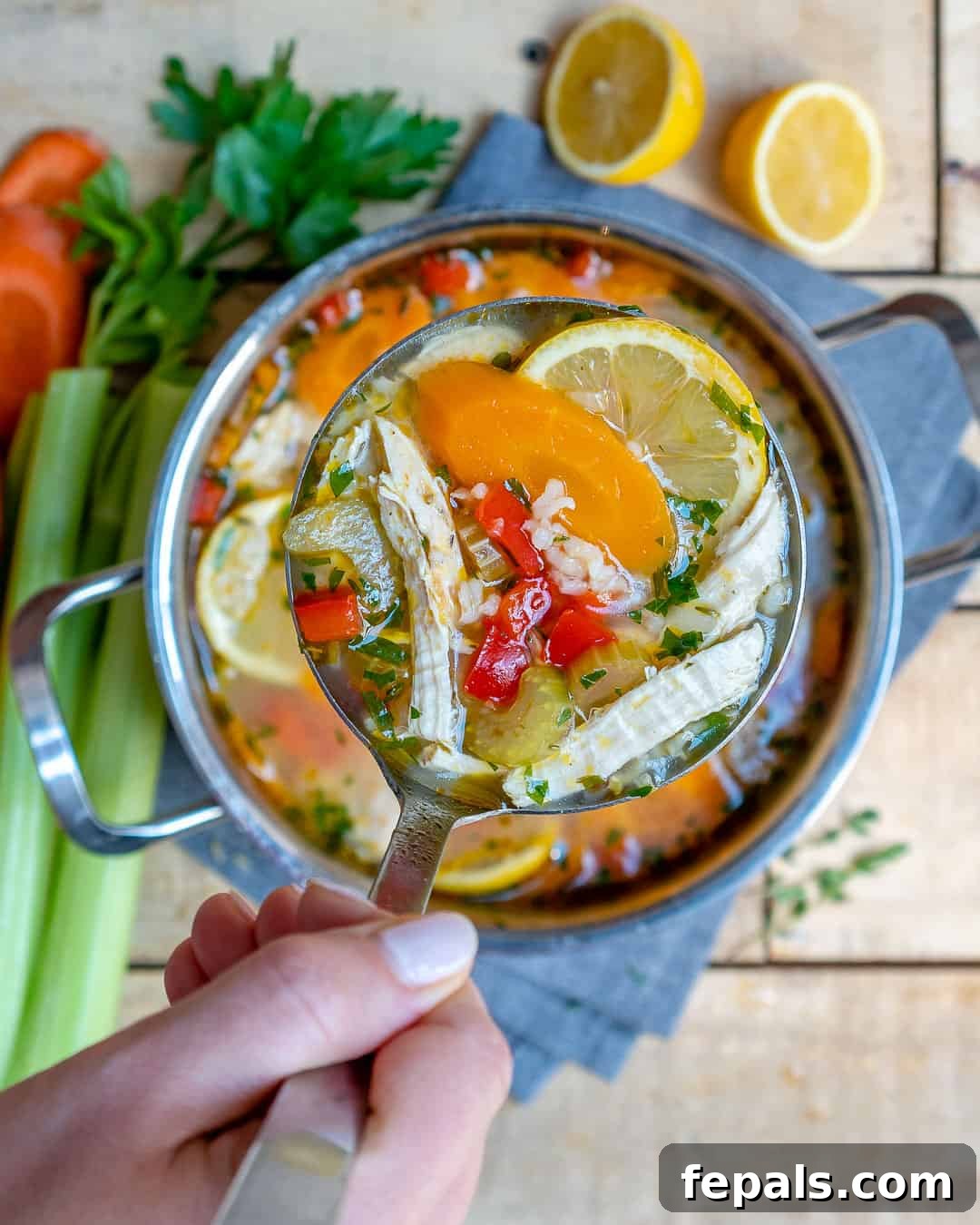A hearty bowl of homemade chicken and rice soup, showcasing its rich texture and fresh ingredients.