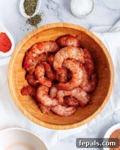 shrimp seasoned with seasonings in a bowl.