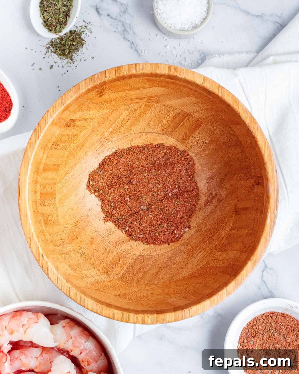 All the fajita seasonings mixed together in a small bowl, creating a vibrant blend of spices.