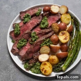 Sheet Pan Steak with Kale Pesto on white plate