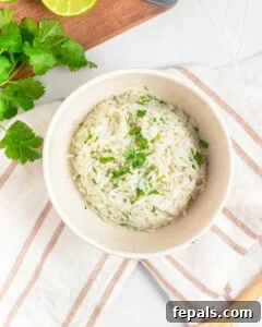 rice mixed with chopped cilantro in a bowl.