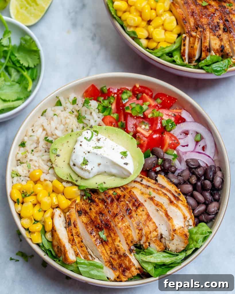 Fiesta Chicken Bowl 10 Top view of a burrito bowl with sliced grilled chicken, rice, beans, corn, and avocado.