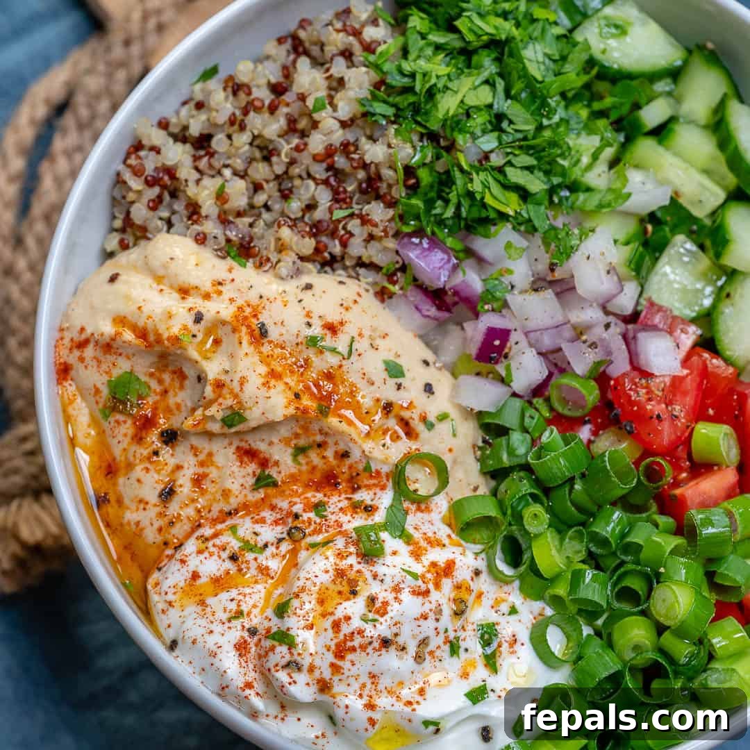 Plant-Powered Quinoa and Hummus Bowl 3 Close-up of fresh vegetables and cooked quinoa, ready for assembly in a healthy veggie bowl